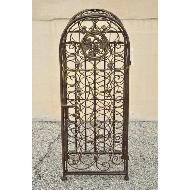 Contemporary Mediterranean Style Wrought Iron 37 Wine Bottle Slot Holder Stand with Door. Item features 37 bottle slots,...