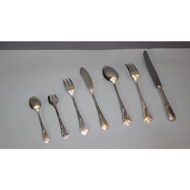 Cutlery set by silversmith François Frionnet, 84 pieces including a fish service, forks, spoons, knives, teaspoons, and...