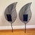 The sconces utilize a woven metal wire mesh framed by sculpted iron or steel rods, mimicking natural leaf veins and a...