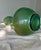 This sculptural Japanese Art Deco–inspired glass form features a luminous green iridescent finish and an elegant bulbous...