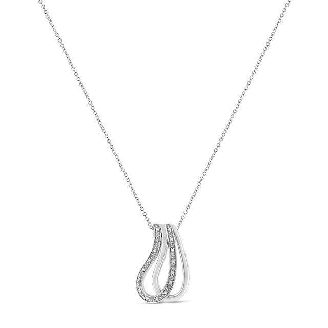 This exquisite diamond pendant will stun the onlookers. Fashioned in lustrous sterling silver this intricately designed...