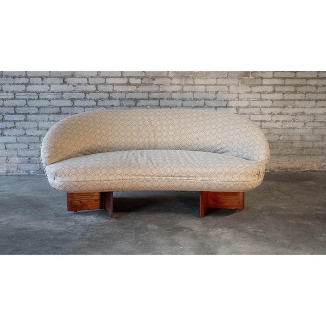 Vladimir Kagan for Kagan-Dreyfuss Inc. loveseat sofa with walnut base, c. 1950s. Organic sculptural form, sweeping curved...
