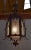 Hexagonal lantern with natural wrought iron frame. Its six rectangular faces are composed of Granite Glass on the outside,...
