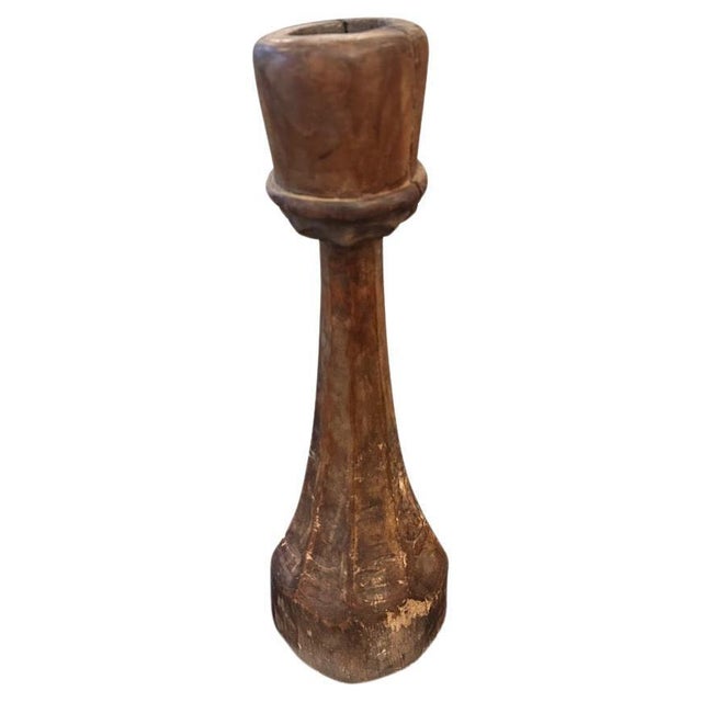 Beautiful hand carved antique candle holder. Full dimensions; 18.5″ high x 4″ diameter top x 5.5″ diameter bottom. Circa...
