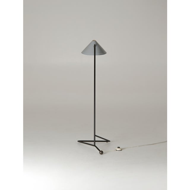 A very rare 1955 mid-century floor lamp designed by H.Th.J.A. Busquet for Hala Zeist. The design features a black tubular...