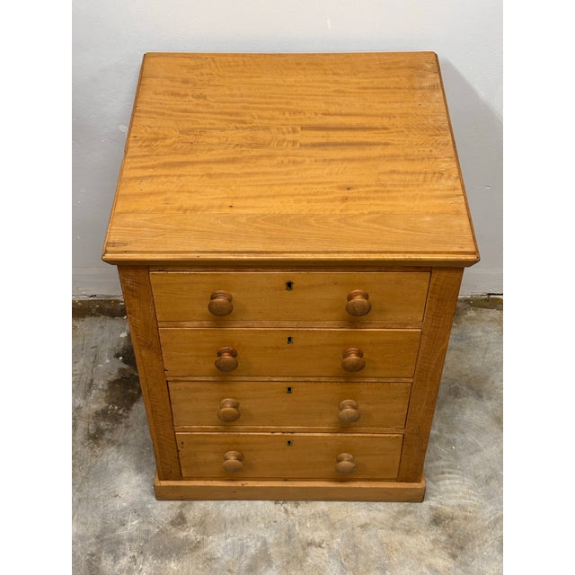 A delightful 19th century English bank of drawers, distinguished by its diminutive size and finely paneled detail. Though...