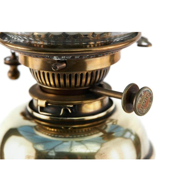 Antique Brass Oil Lamp with decorative globular shade with Hinks No 2 safety burner above the decorative brass font...