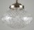 Traditional style pendant light made of an etched glass globe and a brass finish steel chain fitter. This requires one...