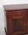 Low antique sideboard from the 1880s, made of hand-polished mahogany. The sideboard is furnished with fixed shelves and...