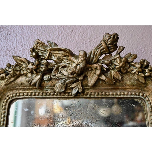Poetic and charming, this pedimented mirror, or wedding mirror, evokes the gentle elegance of late 19th-century bourgeois...
