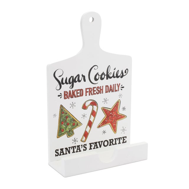 Bring the spirit of the holidays into your kitchen with the Santa's Favorite Cookie Cookbook Holder! Standing 13.5 inches...