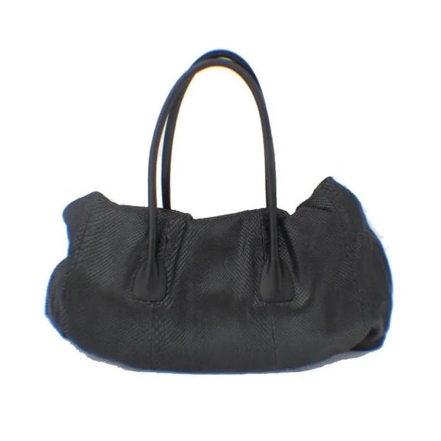 This beautiful Jil Sander snakeskin bag is a fashionistas dream. The exterior is in perfect condition with no signs of...