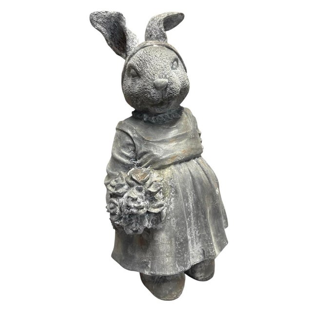 This charming vintage cast iron statue depicts an anthropomorphic female rabbit captured in a sweet, timeless pose....