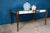 Bright and captivating, this 1940s coffee table is a lovely piece of French Art Deco. Its mirrored glass top, with its...