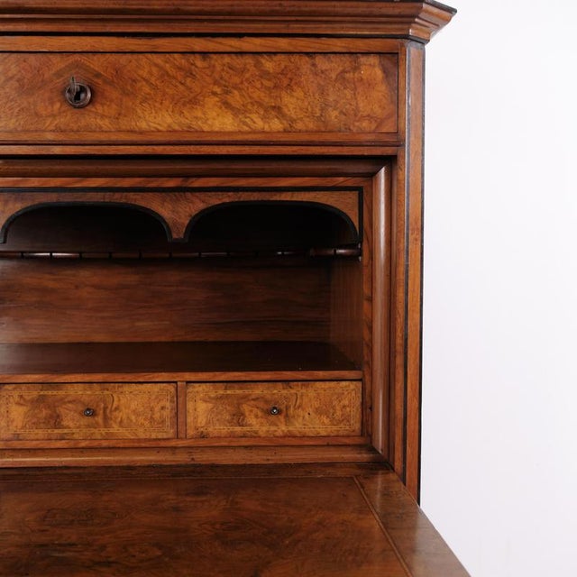 Antique secretaire from the 1840s made of hand-polished mahogany. The secretaire features four drawers and a writing flap,...