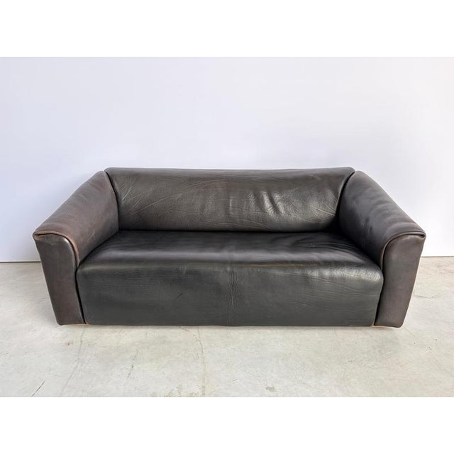 Gorgeous dark brown neck leather sofa. De Sede, renowned for using the best quality leather has created some wonderful...