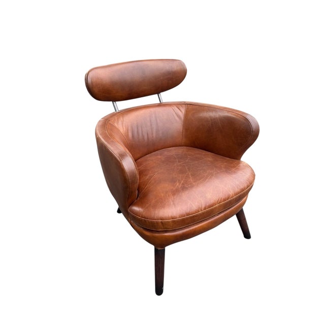 Pair of French 1950’s leather club chairs. Great condition. all original. 26”l x 28”d x 31”h seat 16”h 49-108