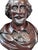 A finely carved 20th-century mahogany bust of William Shakespeare, showcasing exquisite craftsmanship characteristic of...