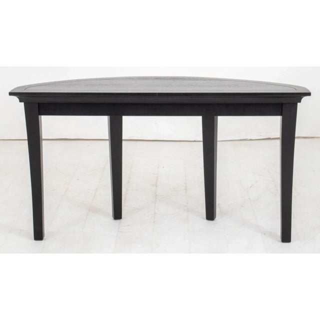 The modern ebonized wood demilune table you have sounds like a stylish and potentially valuable piece, especially...