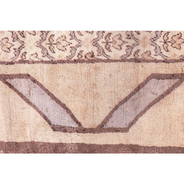 This exquisite Turkish Hereke rug, dating from the 1940s, exemplifies the delicate artistry and refined aesthetic of...