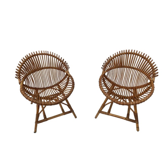 Rare Pair of original armchairs produced by Bonacina, in Italy 1960s. With a particular egg shape, it is made of bamboo...