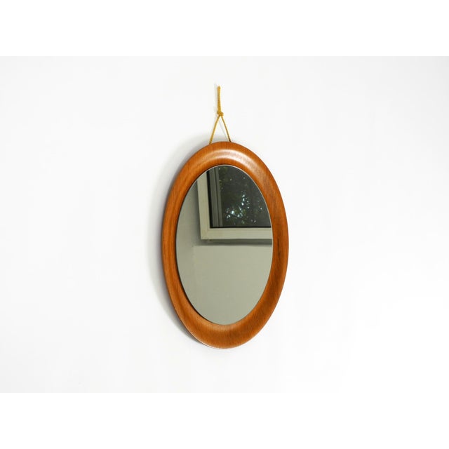 Super rare round Mid-Century Modern wall mirror by ARY Fanerprodukter Nybro. Made in Sweden. The frame is made of Pagholz...