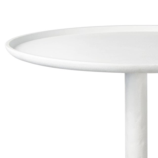 Inspired by a paper mache sculpture, this versatile table is at home in a variety of spaces. Complex curves, paired with a...