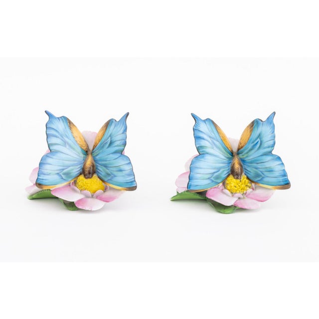 Pair of Herend Painted Butterfly and Flower Porcelain Figurine, marked "Herend Hungary / Handpainted / 16" to underside....