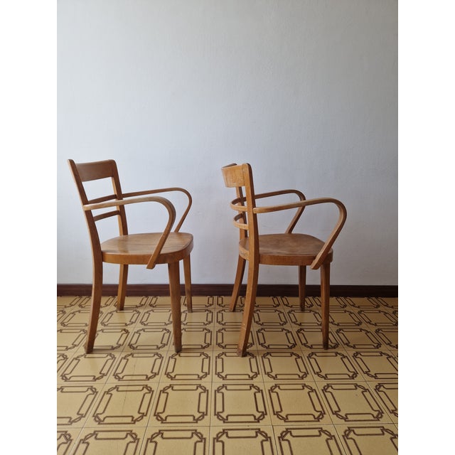 A splendid pair of office or dining chairs dating back to the 1950s, produced by the historic italian brand arc vimercate...