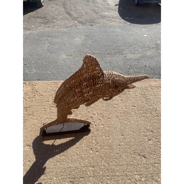 Marlin sculpture made of hemp wire on wooden base. Handcrafted woven marlin sculpture features an intricate natural...