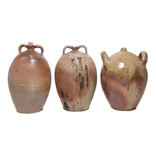 Set of Three French Provincial Stoneware Oil Jugs, Double-Handled Terracotta Vessels With Natural Ash Glaze | 19th Century For Sale