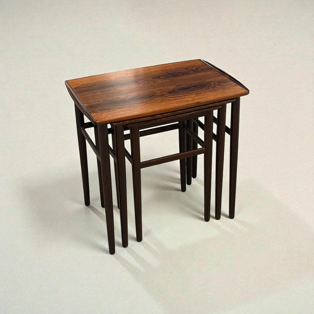 Edmund jørgensen rosewood nesting tables, set of 3, nakskov, denmark, c. 1960s set of three danish nesting tables produced...