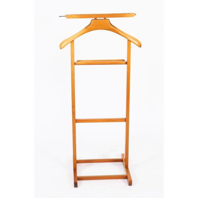 This is an elegant English Edwardian revival walnut gentleman's valet/clothes stand dating from the mid 20th century. The...
