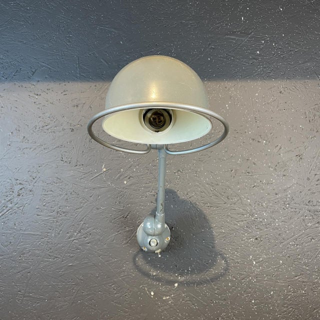 Beautiful original smaller one arm Jielde lamp in grey. Designed by the French engineer Jean-Louis Domecq in the 1950s to...