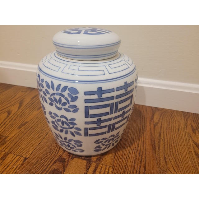 One blue and white ceramic urn in excellent condition. Made in China.