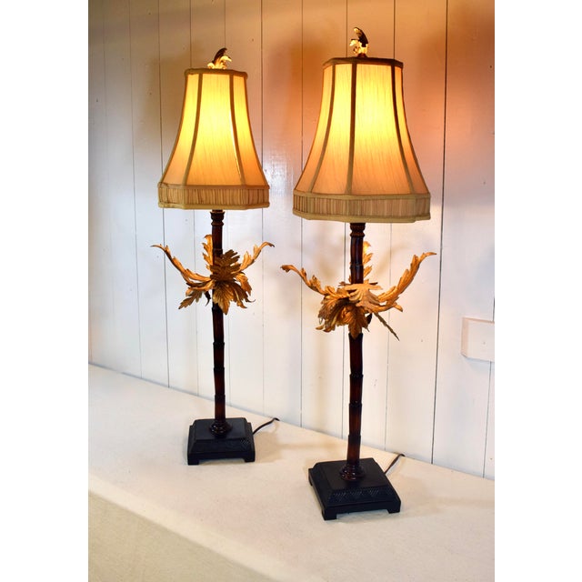 A pair of decorative Palm Tree table lamps attributed to Maitland Smith. Striking features include faux palm tree design...