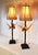 A pair of decorative Palm Tree table lamps attributed to Maitland Smith. Striking features include faux palm tree design...