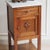 This French bedside table dates from around 1900 and belongs to the late Historicist style with a regional French...
