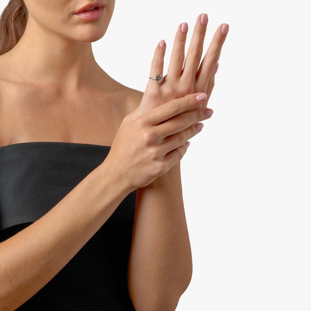 This exceptional Mid Century engagement ring showcases a striking 3.99 carat transitional cut diamond, offering a...