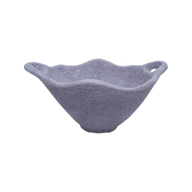 Earthy, sculptural, and effortlessly refined, this bowl brings a grounded, organic presence to any space. Crafted with a...