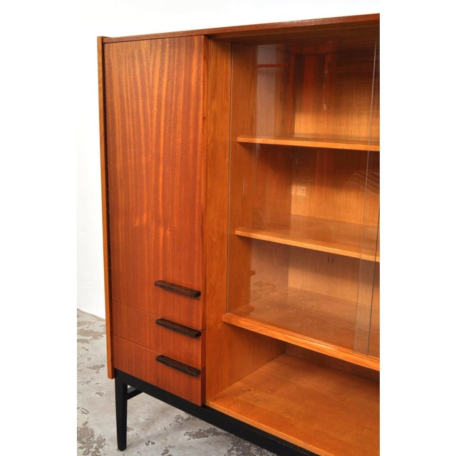 Produced by up závody in the 1960s. Stylish and sleek teak cabinet with beautiful details. the cabinet has a door with...