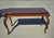 This is a vintage Chippendale or French-style walnut writing desk showcasing highly ornate period-style craftsmanship. Key...