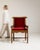 A classic Voltaire armchair characterized by its high back and reclining comfort, originally designed in 19th century...
