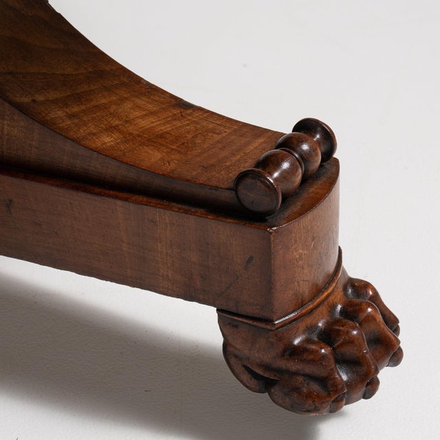 Marble-top mahogany pedestal table in Rich Mahogany. Its rich mahogany finish sets off grey marble top, scrolled pedestal...