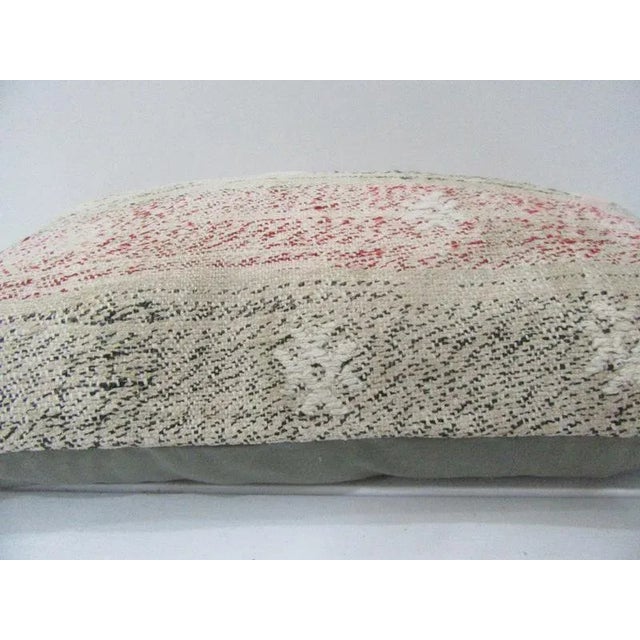 This is a pillow cover made from a vintage kilim rug. The piece was properly washed and ready to use. Pillow inserts not...