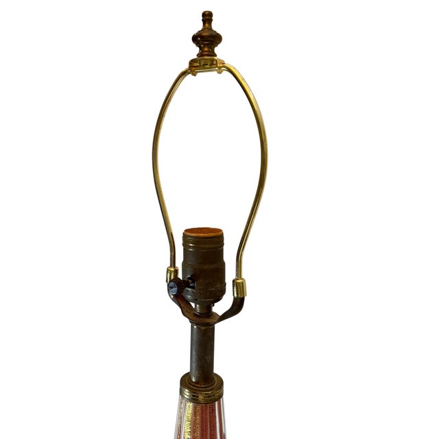 An elegant mid century Barovier & Toso Murano table lamp crafted in luminous pink opalescent glass with delicate gold...