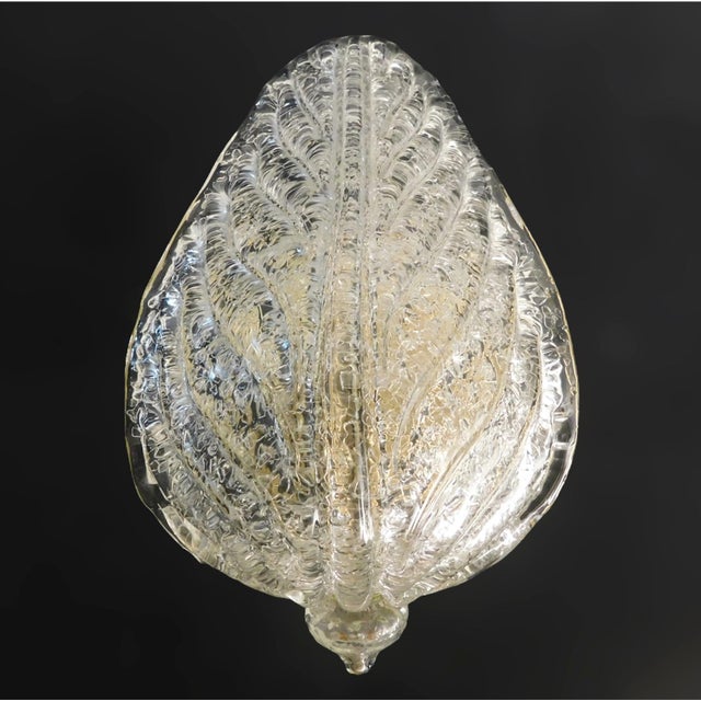 Italian wall light with a clear Murano glass leaf hand blown with Graniglia to produce granular textured effect / Made in...