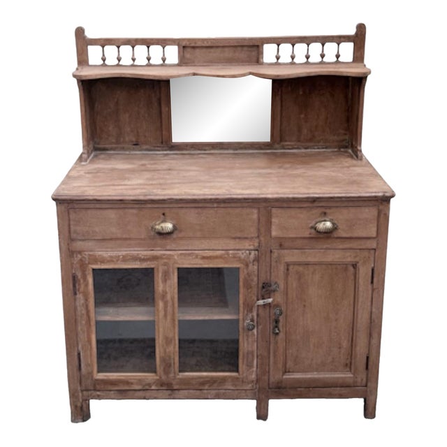 This European petite dresser cabinet is a wonderfully compact yet visually striking piece, blending the practicality of a...