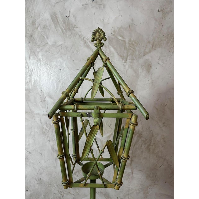 This lantern features a very elegant bamboo-inspired structure, with finely sculpted metalwork mimicking the natural stems...