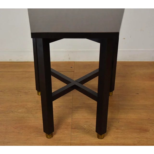 A mid century modern formica top end table designed by Edward Wormley for Dunbar. Front edge width measures 12”. 20” wide....